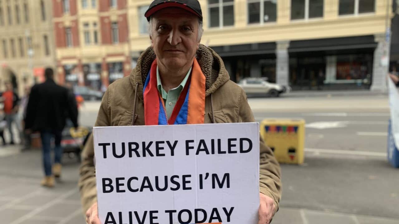 A participant in the rally in Melbourne to mark 106 years since the massacre of Armenians in the Ottoman Empire. 