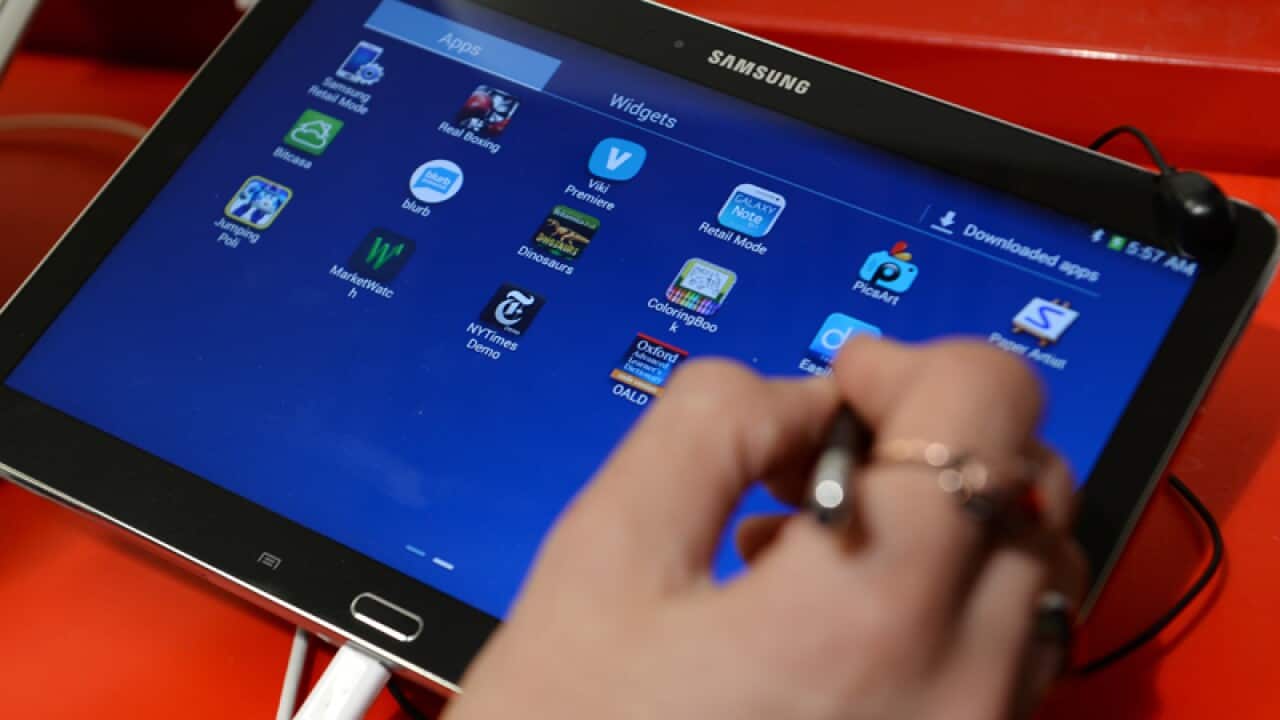Samsung tablet being used.