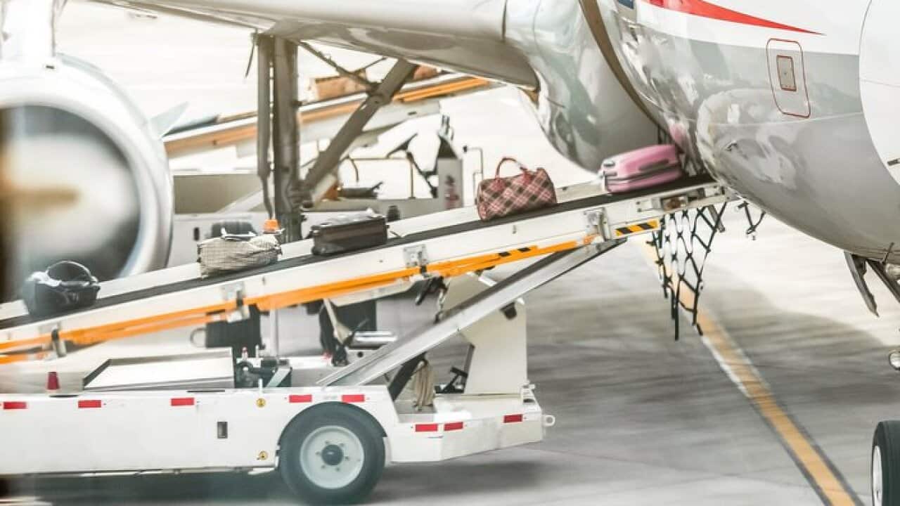 airplane loading luggage