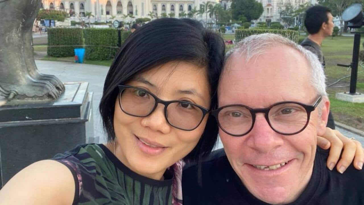 Australian Sean Turnell (R) and his wife (L)