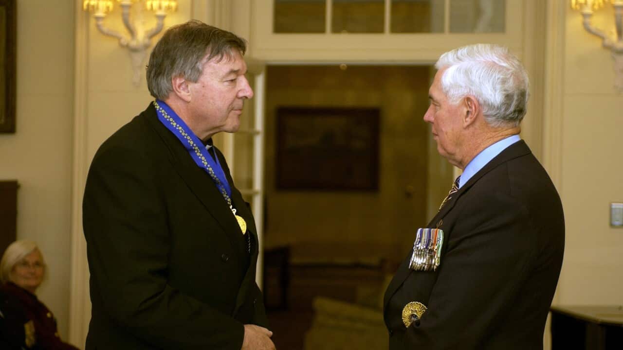 Cardinal George Pell receives the Order of Australia from Governor General Michael Jeffery in Canberra, September 2, 2005.