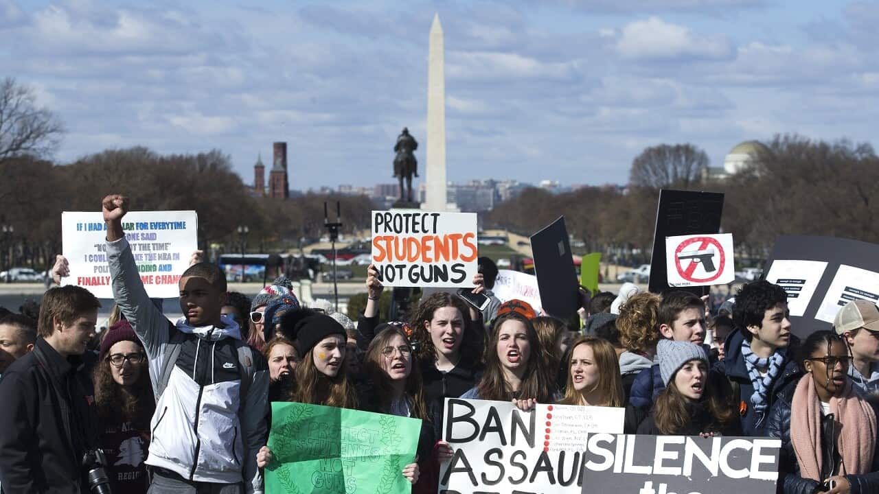 Young people rally on the West Front of the US Capitol to participate in the national school walkout over gun violence, in Washington