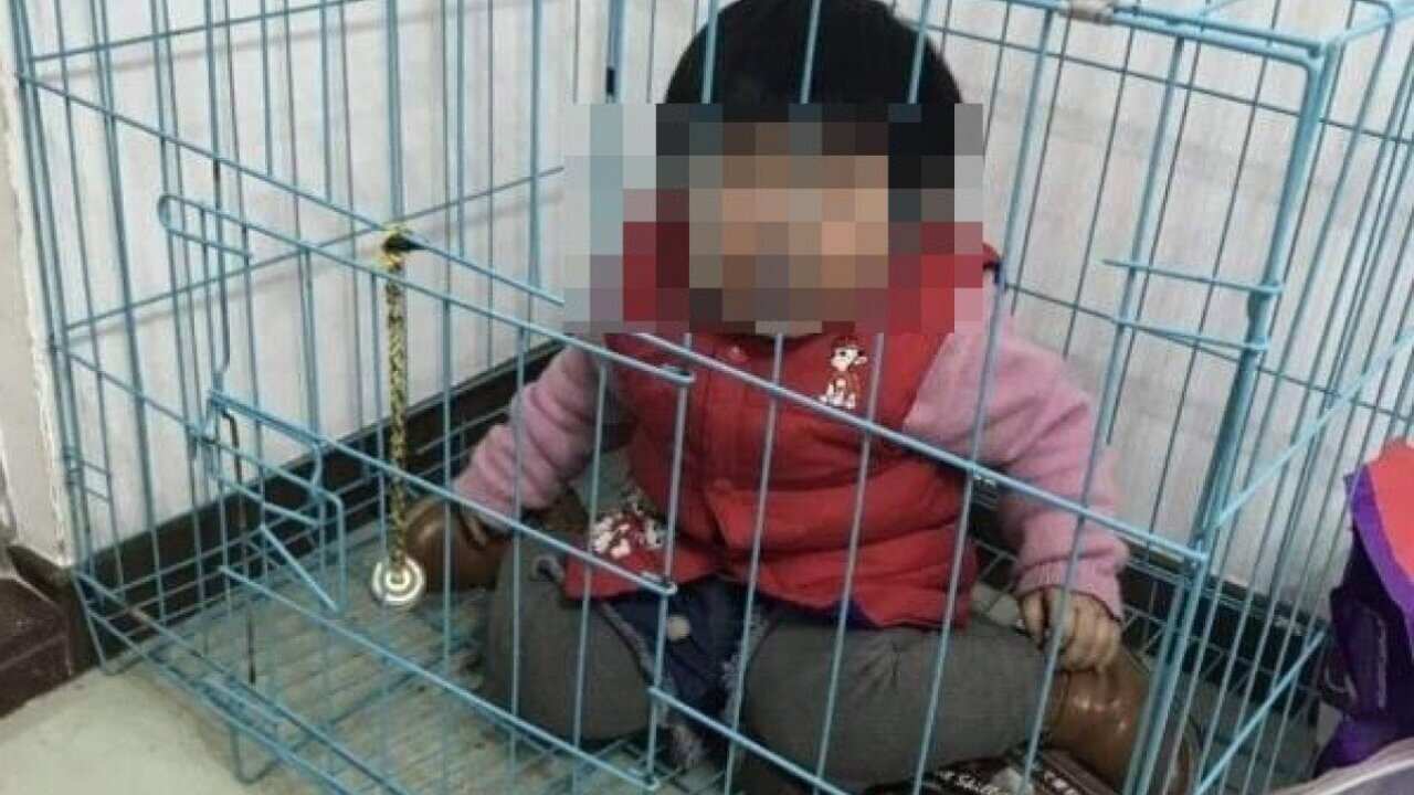 Girl locked by father in cage