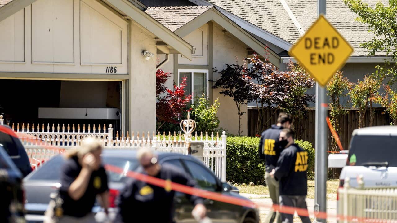 FBI agents approach a home being investigated in a shooting at a Santa Clara Valley Transportation Authority (VTA) facility on 26 May 2021.