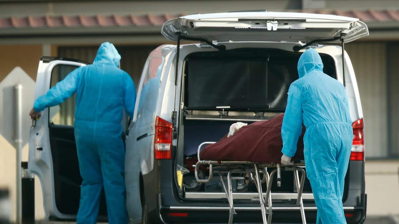 A body is removed from St Basil’s Homes for the Aged in Fawkner, Melbourne, Friday, July 31, 2020. (AAP Image/Daniel Pockett) NO ARCHIVING