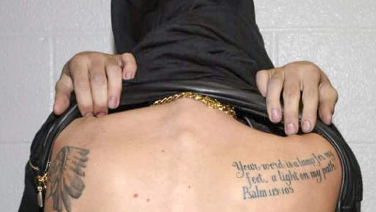Singer Justin Bieber displaying tattoos on his body