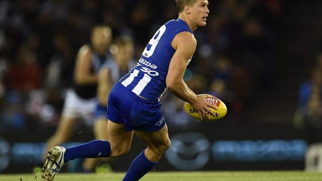 Andrew Swallow of the Kangaroos in action