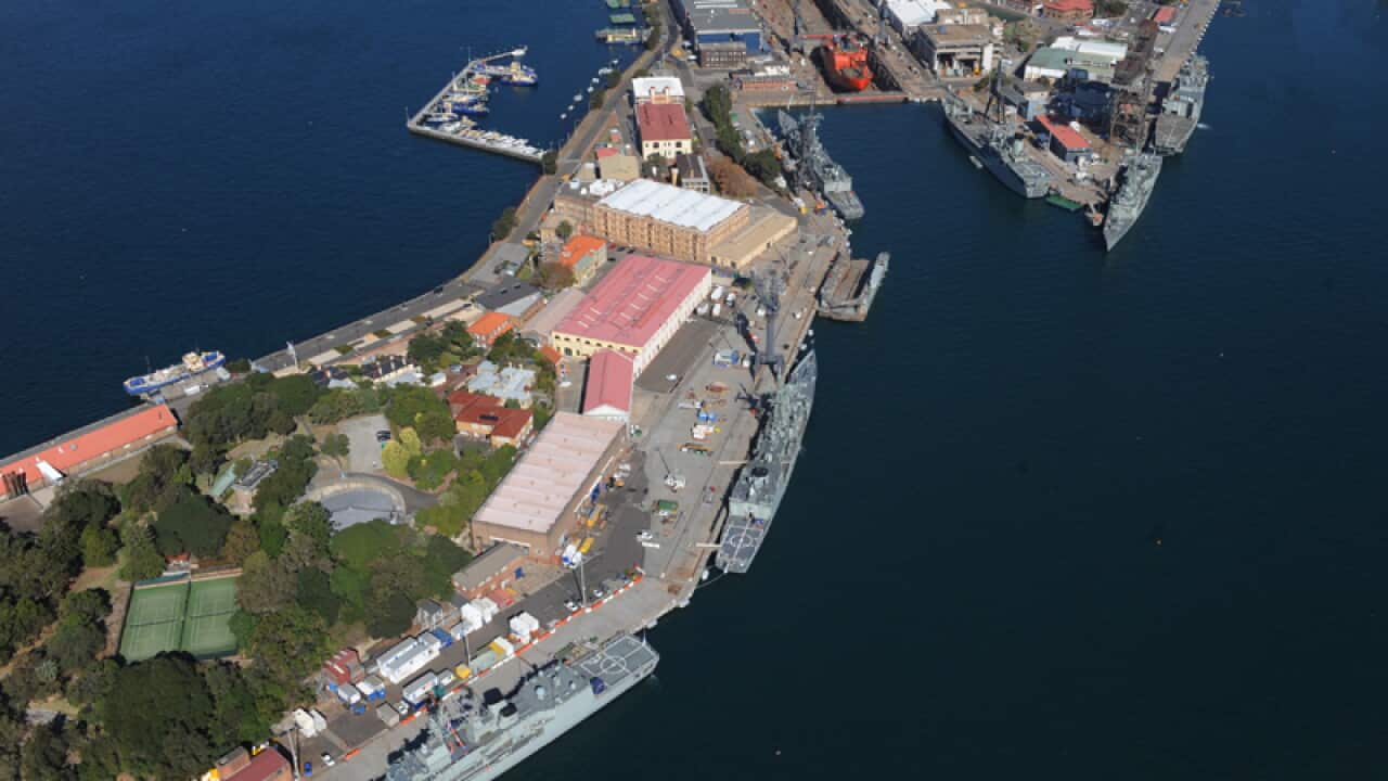 An aerial view of naval ships docked at Garden Island