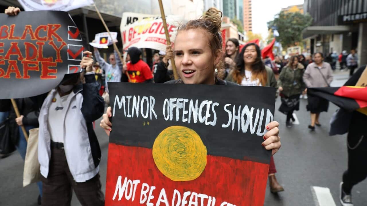 Woman at the rally with a sign