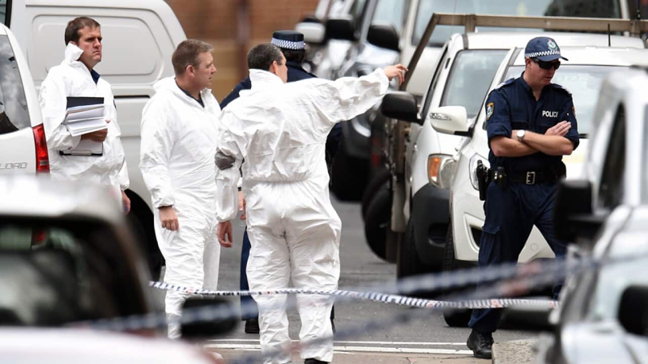 Forensic Services personnel are seen in Martin Place