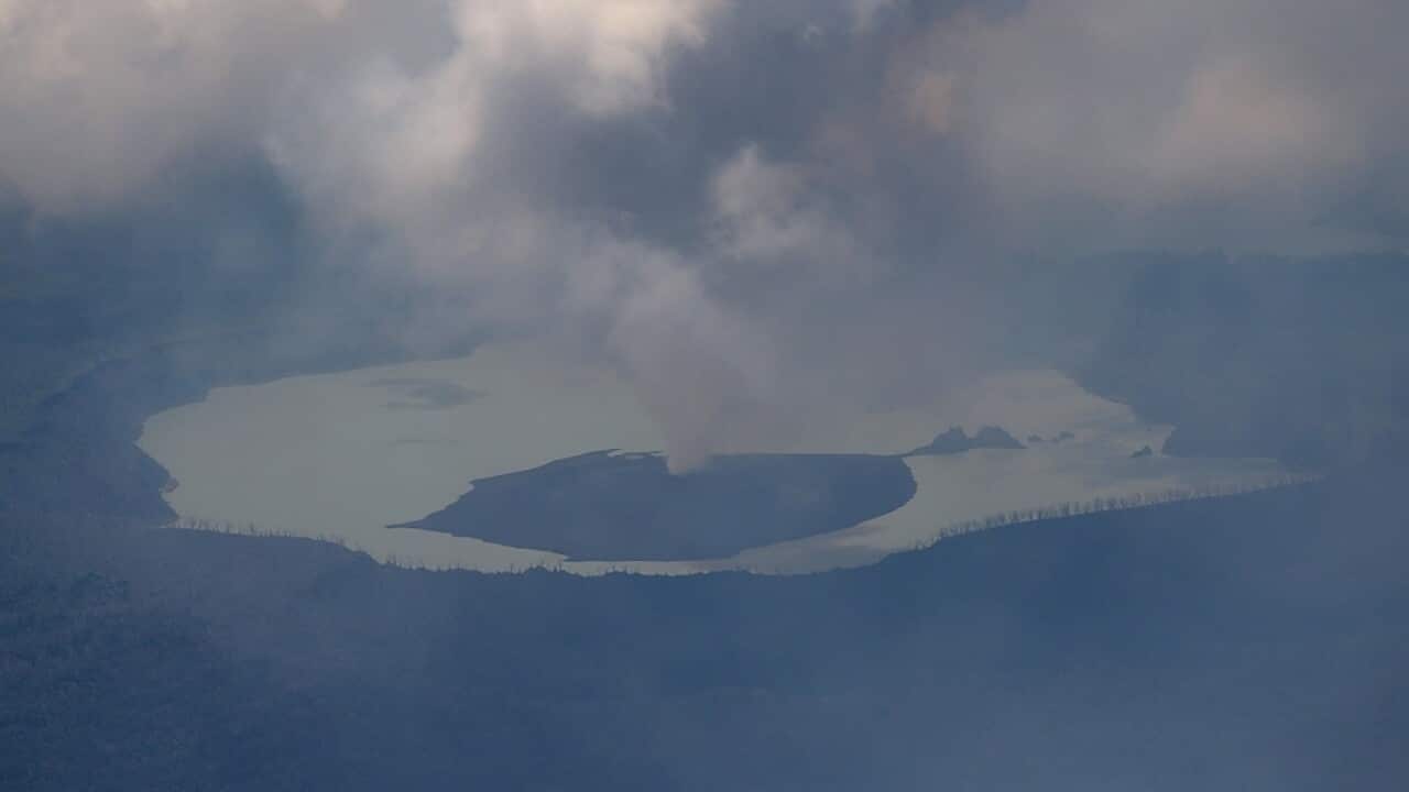 Sept. 26, 2017 photo provided by the NZDF, shows columns of smoke, ash and rocksbillowing from the crater of an erupting volcano on Vanuatu's Ambae Island.