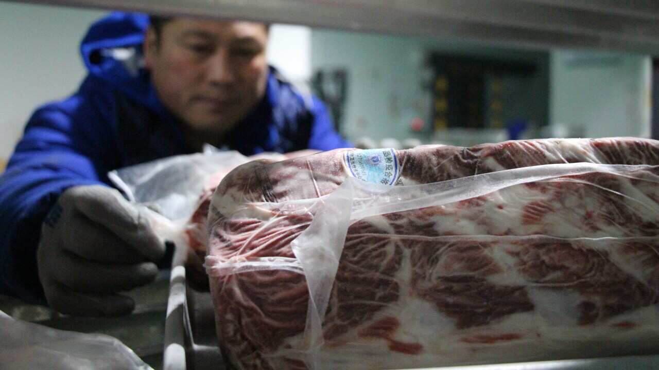 A worker at a beef refinement processing plant in Binzhou city, Shandong Province, China.