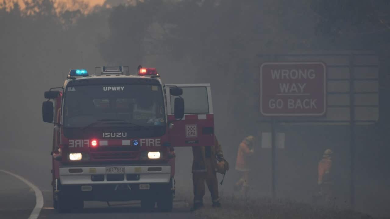A CFA fire crew is seen along the Princes Highway outside of Bunyip in Victoria, Sunday, March 3, 2019 (AAP)