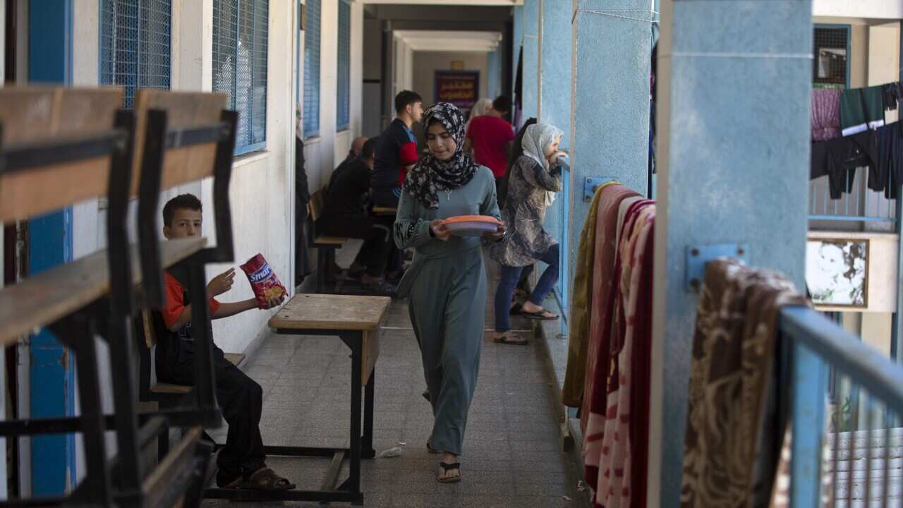 Palestinians take shelter at a school run by the U.N. after fleeing heavy Israeli missile strikes in the outskirts of Gaza City.