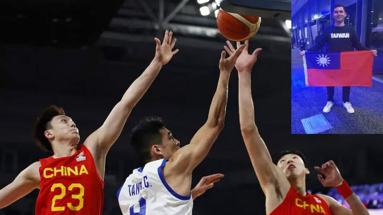 Chinese Taipei and China competed in the FIBA World Cup Asian Qualifier match on Friday night, where attendees say they were not allowed to display Taiwan flags. Inset: Andrew Farrugia holds the Taiwanese flag after he is allowed to reclaim it from the cl