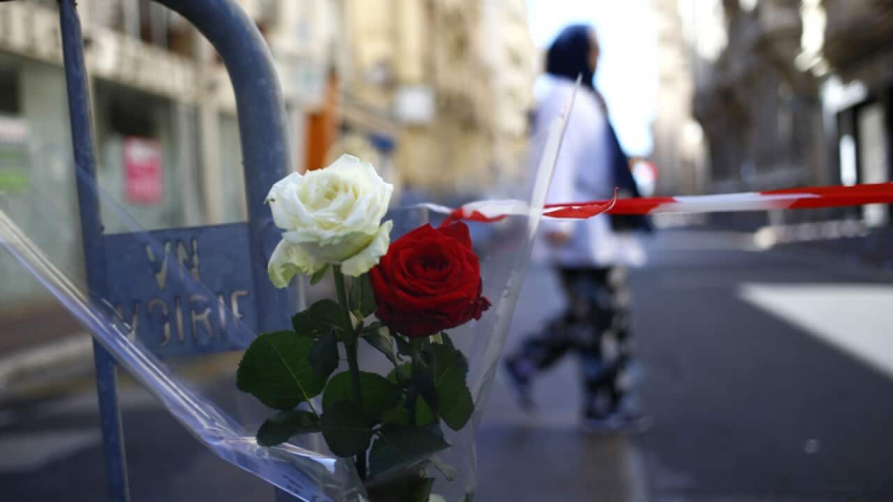 Roses are attached at a barrier in Nice