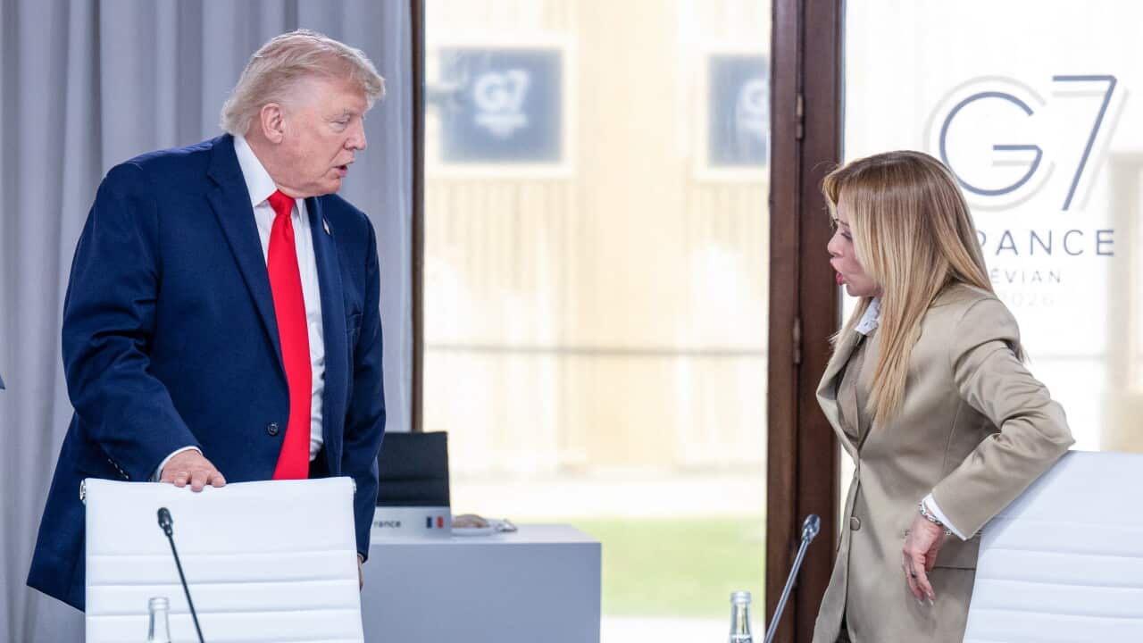 US President Donald Trump (C) speaks with Italy's Prime Minister Giorgia Meloni during a work lunch as part of the G7 summit, in Evian, eastern France, on June 16, 2026.
