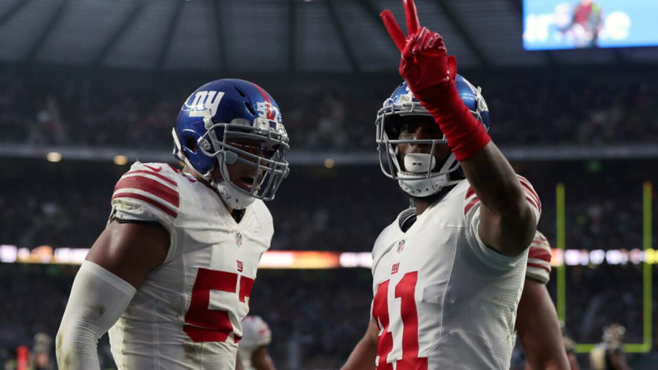 Giants' Dominique Rodgers-Cromartie (R) celebrates