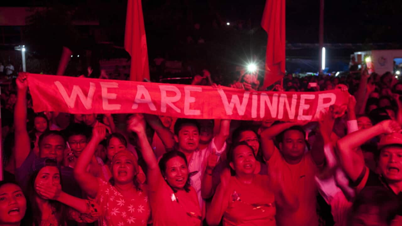 Supporters of Myanmar opposition leader Aung San Suu Kyi
