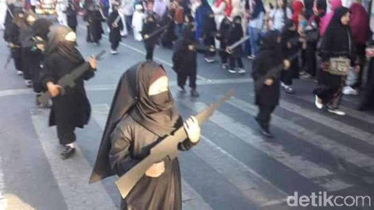 The pre-schoolers, from a kindergarten in Indonesia's East Java, were dressed in niqabs and seen carrying fake assault rifles.