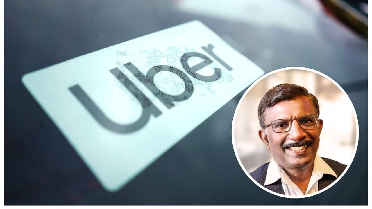 An Uber sign is displayed inside a car