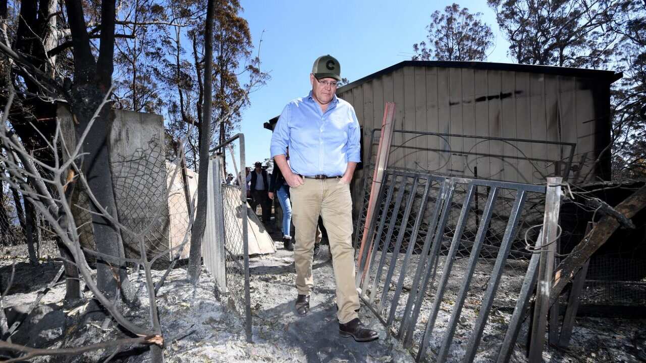 Australian Prime Minister Scott Morrison inspects a burnt-out property at Binna Burra in the Gold Coast