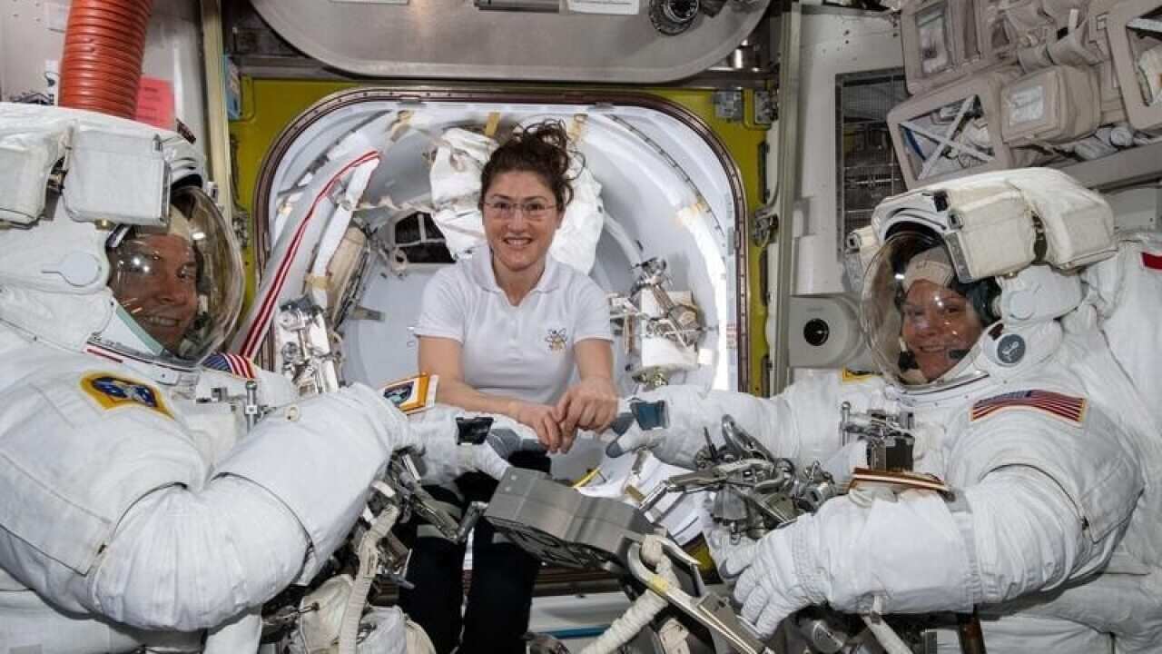 ISS astronauts Christina Koch (C), Nick Hague (L) and Anne McClain