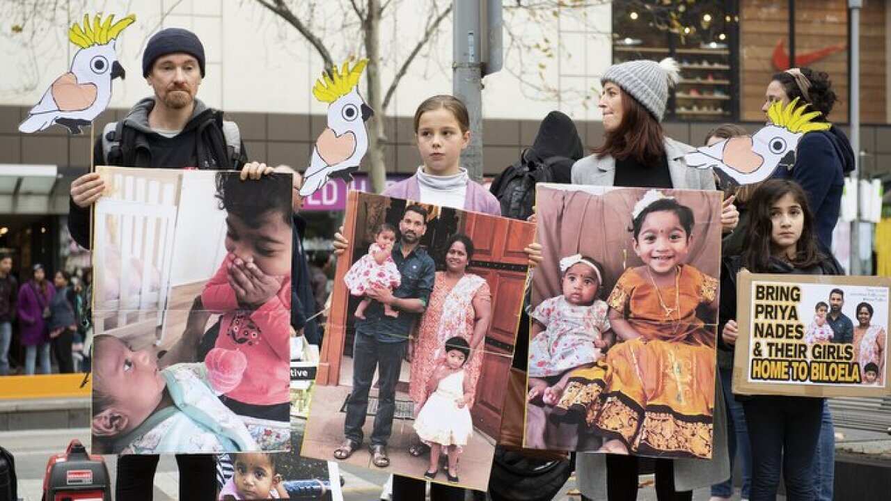 Rally calling to stop the deportation of Priya, Nades and their children back to Sri Lanka , at the State Library, Melbourne. Sunday(AAP Image/Ellen Smith)