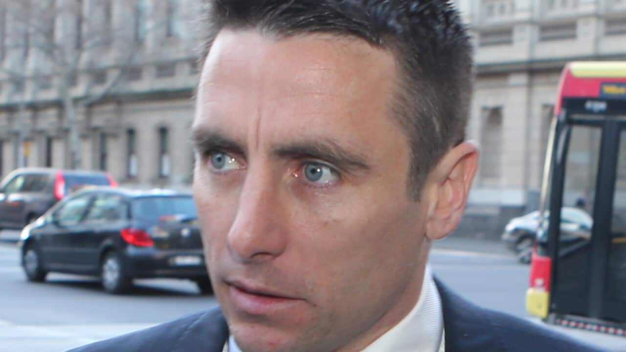 St Kilda AFL football player Stephen Milne leaving court