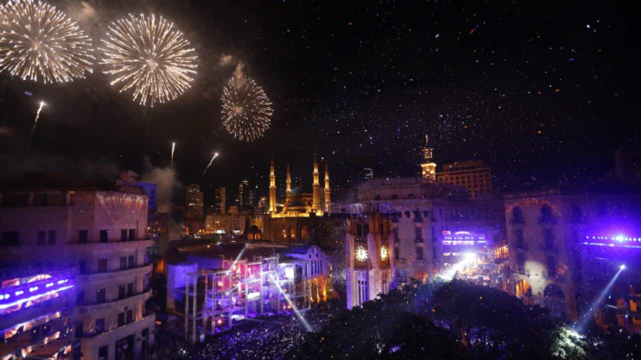 Fireworks explode over the downtown Beirut, Lebanon, during New Year's celebrations