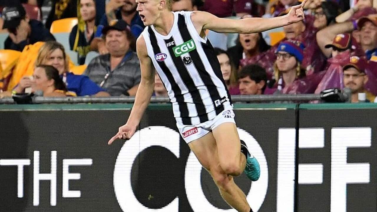 Magpies Jaidyn Stephenson celebrates scoring a goal against Brisbane.