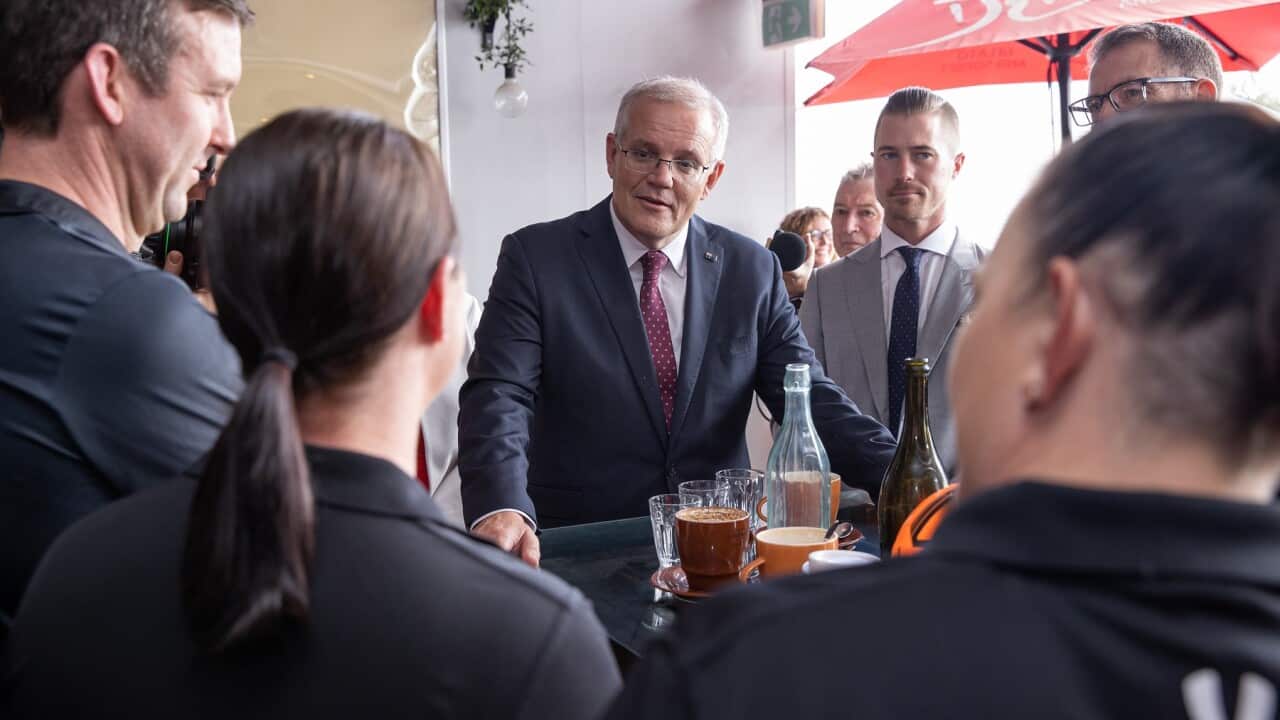 : Prime Minister Scott Morrison and Liberal candidate for Blair Sam Biggins campaigning in Ipswich, QLD (AAP).