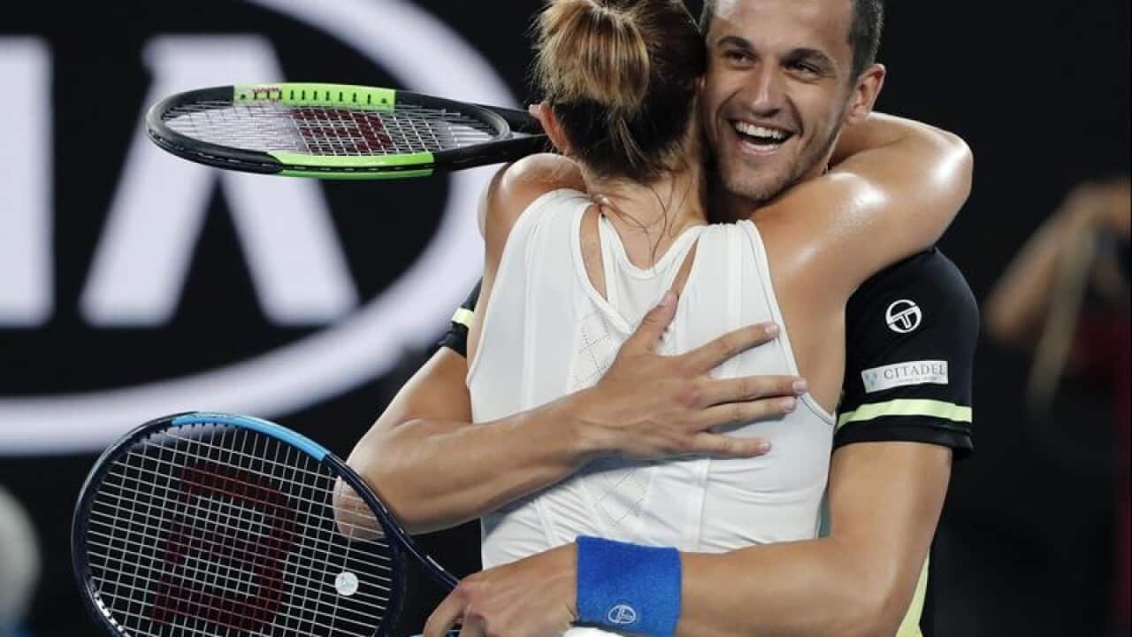 Canada's Gabriela Dabrowski and Croatia's Mate Pavic celebrate.