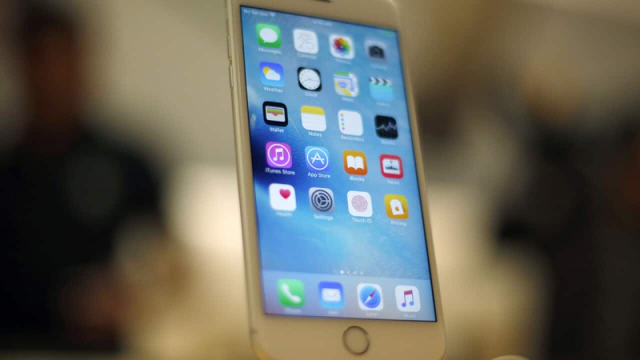 An iPhone on display at an Apple Store
