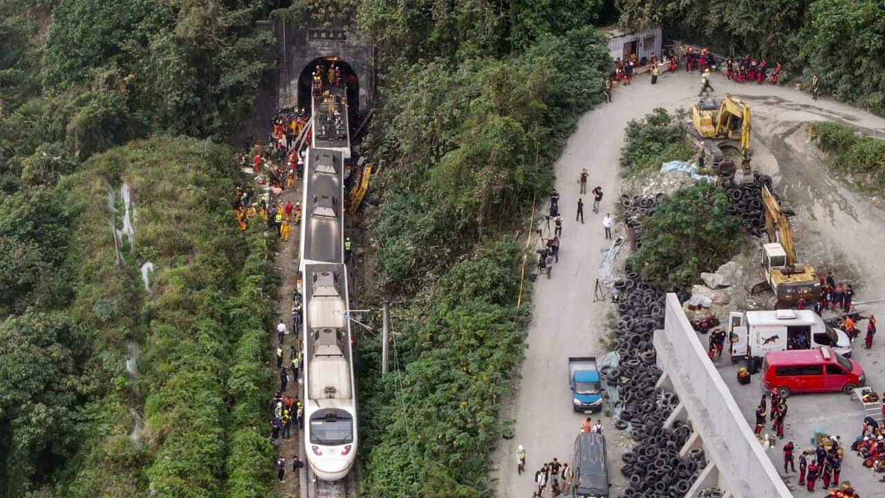 An aerial view shows rescue workers at the site where a train derailed inside a tunnel in the mountains of Hualien, eastern Taiwan on 2 April.
