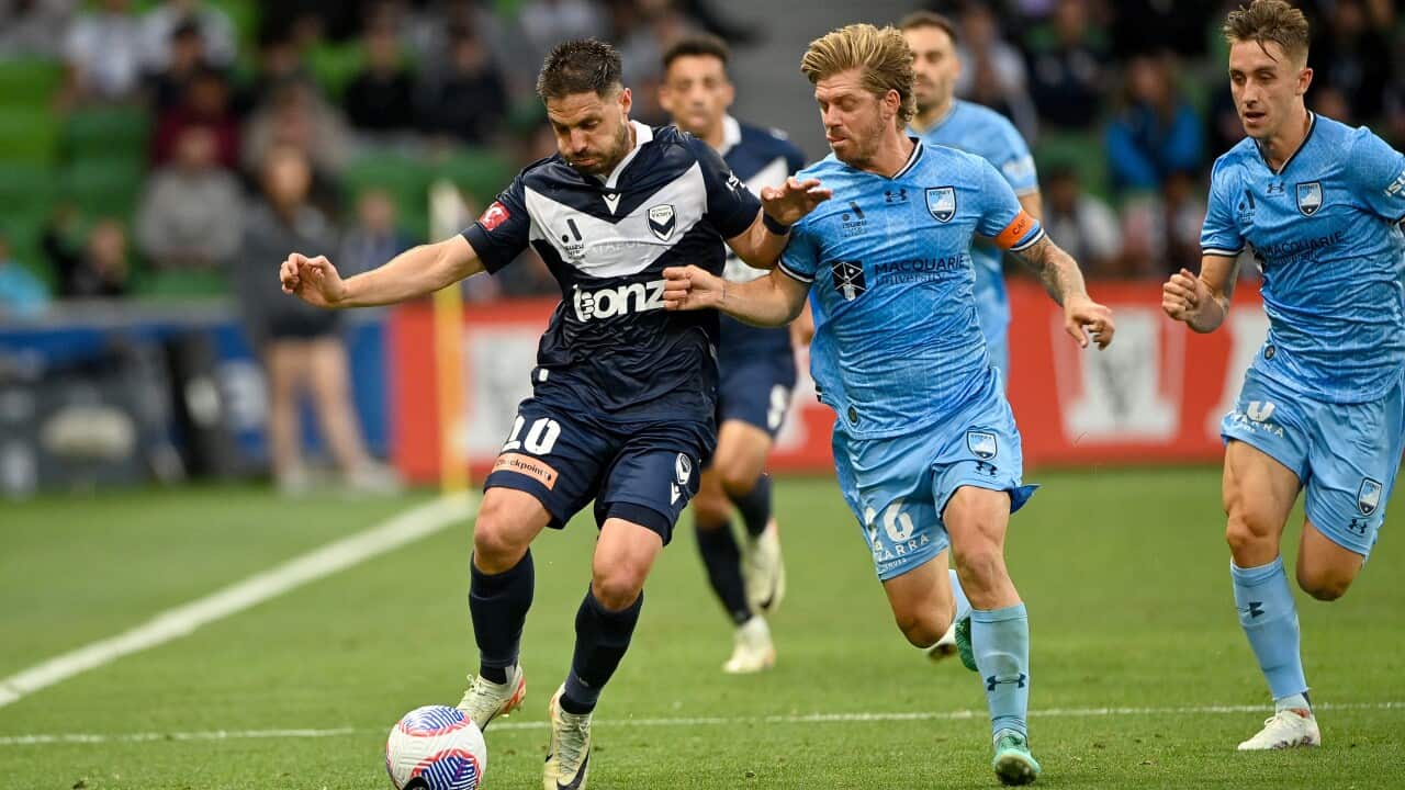 Bruno Fornaroli of Melbourne Victory and Luke Brattan of Sydney FC competes for the ball during the A-League Men Round 8 match at AAMI Park in Melbourne