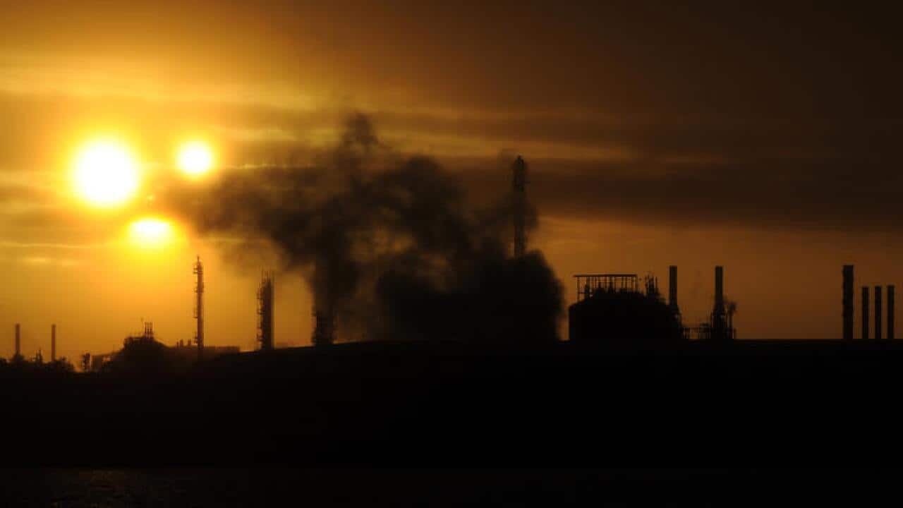 Steam and other emissions rise from an industrial plant in Melbourne, Tuesday, April 29, 2014. The Abbott government's pledge to remove the carbon tax will be tested when the new Senate is formed after July 1. (AAP)
