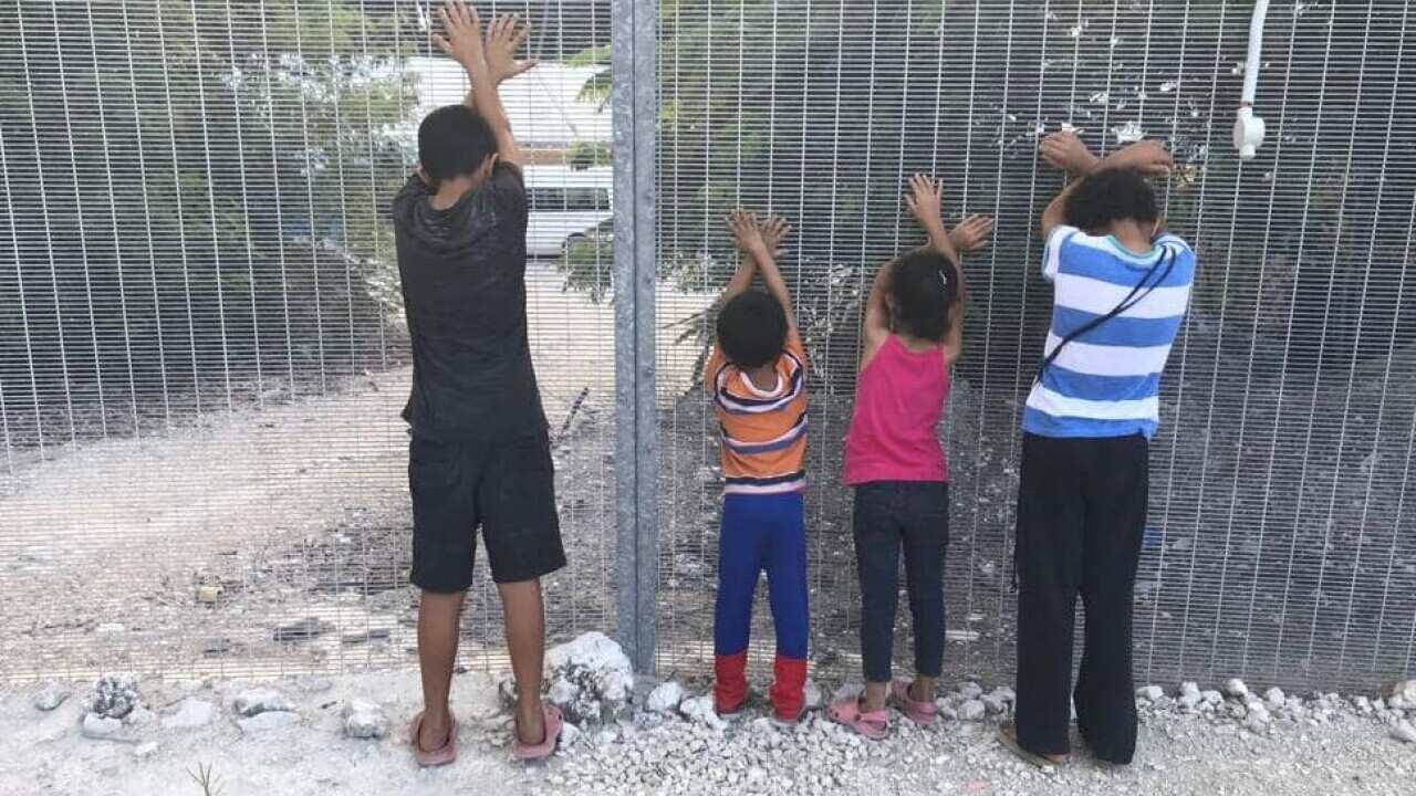 Refugee children play a game on Nauru.