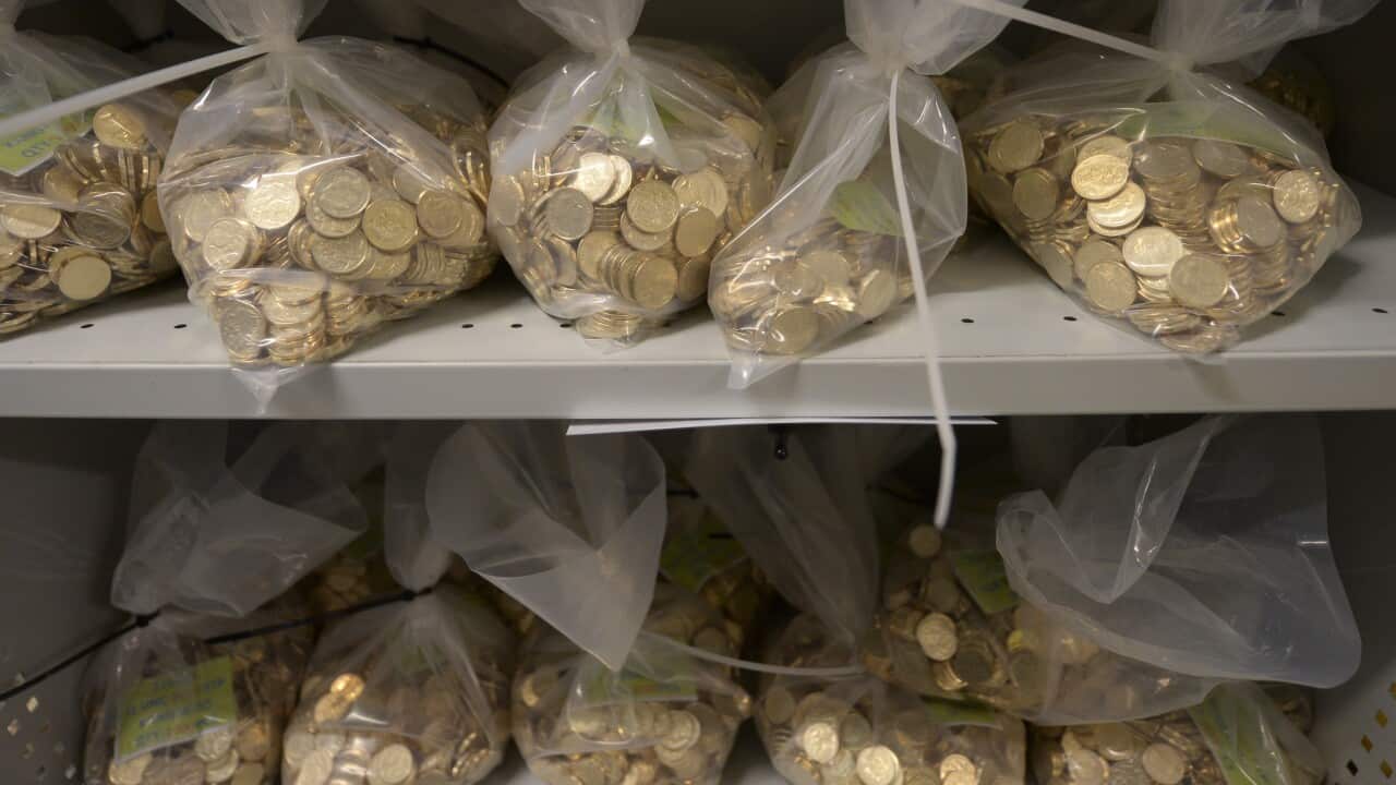 Bags of newly struck coins are stored at the coin production factory at the Royal Australian Mint in Canberra, Wednesday, April 16, 2014. (AAP Image/Lukas Coch) NO ARCHIVING