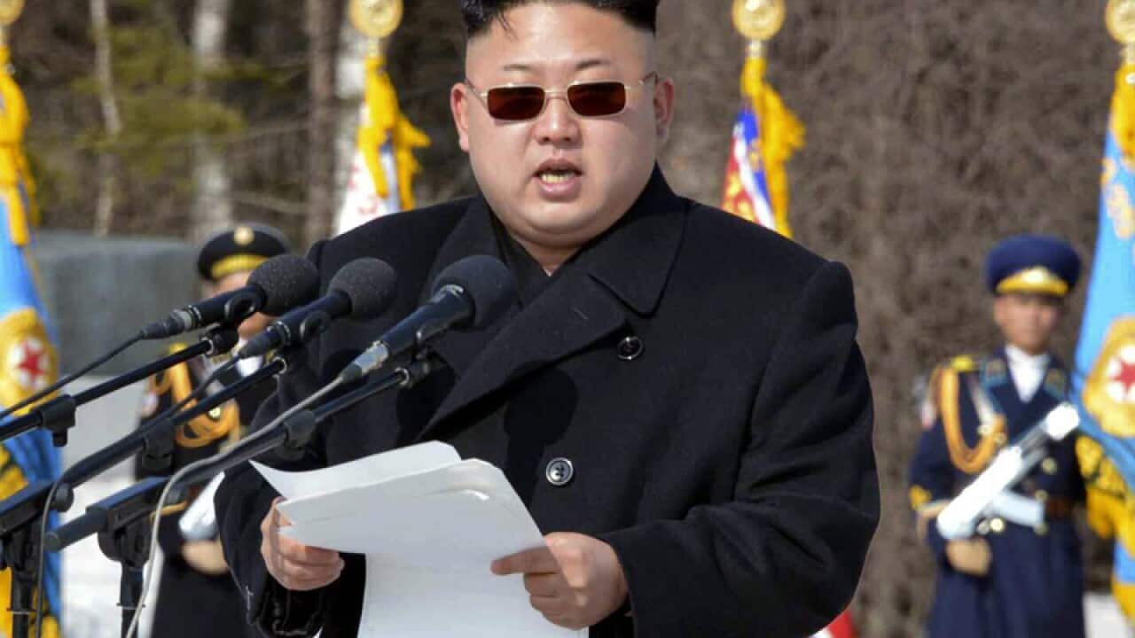 North Korean leader Kim Jong-un wearing sunglasses.