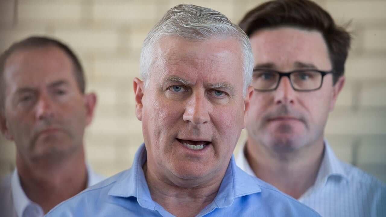 Michael McCormack speaks to the media during a press conference at the Queensland Fire and Emergency Services Deployment Centre on Sunday.