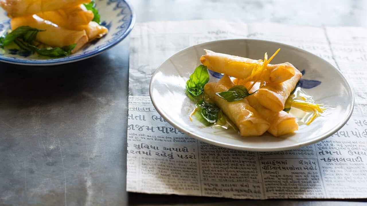 Custard spring rolls with orange syrup