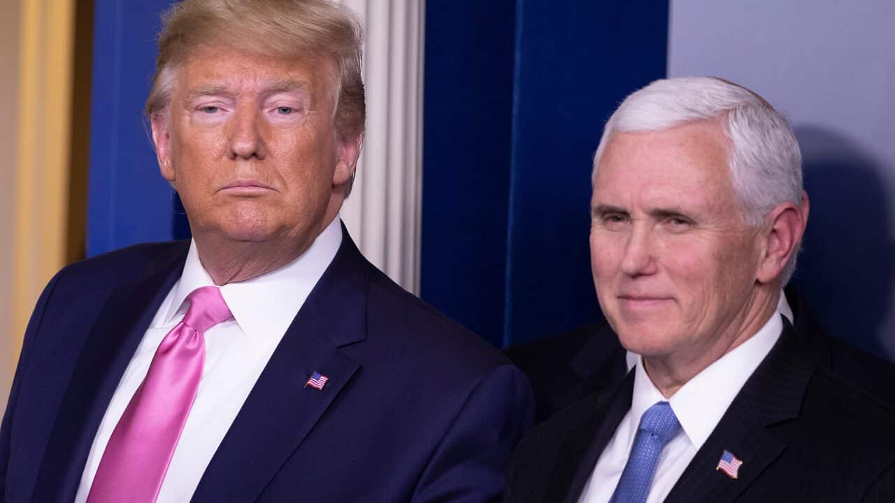 U.S. President Donald Trump looks on after a news conference with Vice President Mike Pence.