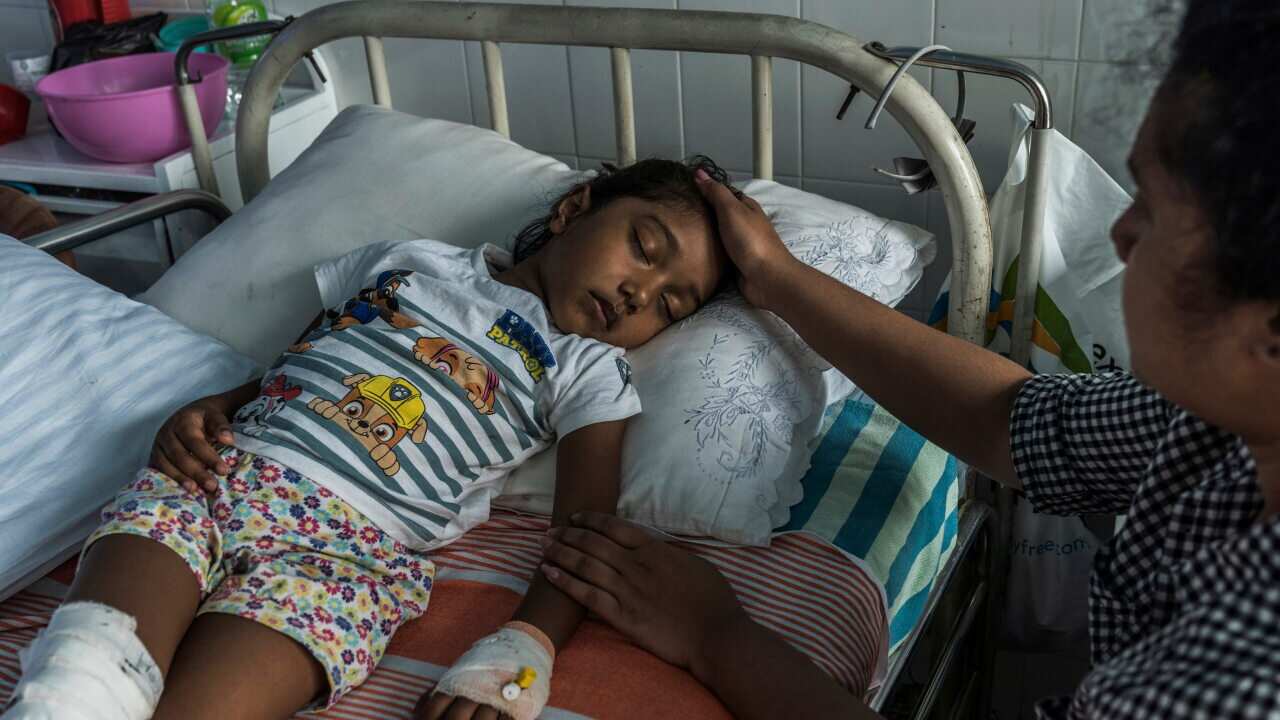 S. Diduni Nihansa, who was wounded in the Easter Sunday bombing at St. Sebastians Church, is comforted by a relative in a hospital in Colombo, Sri Lanka.