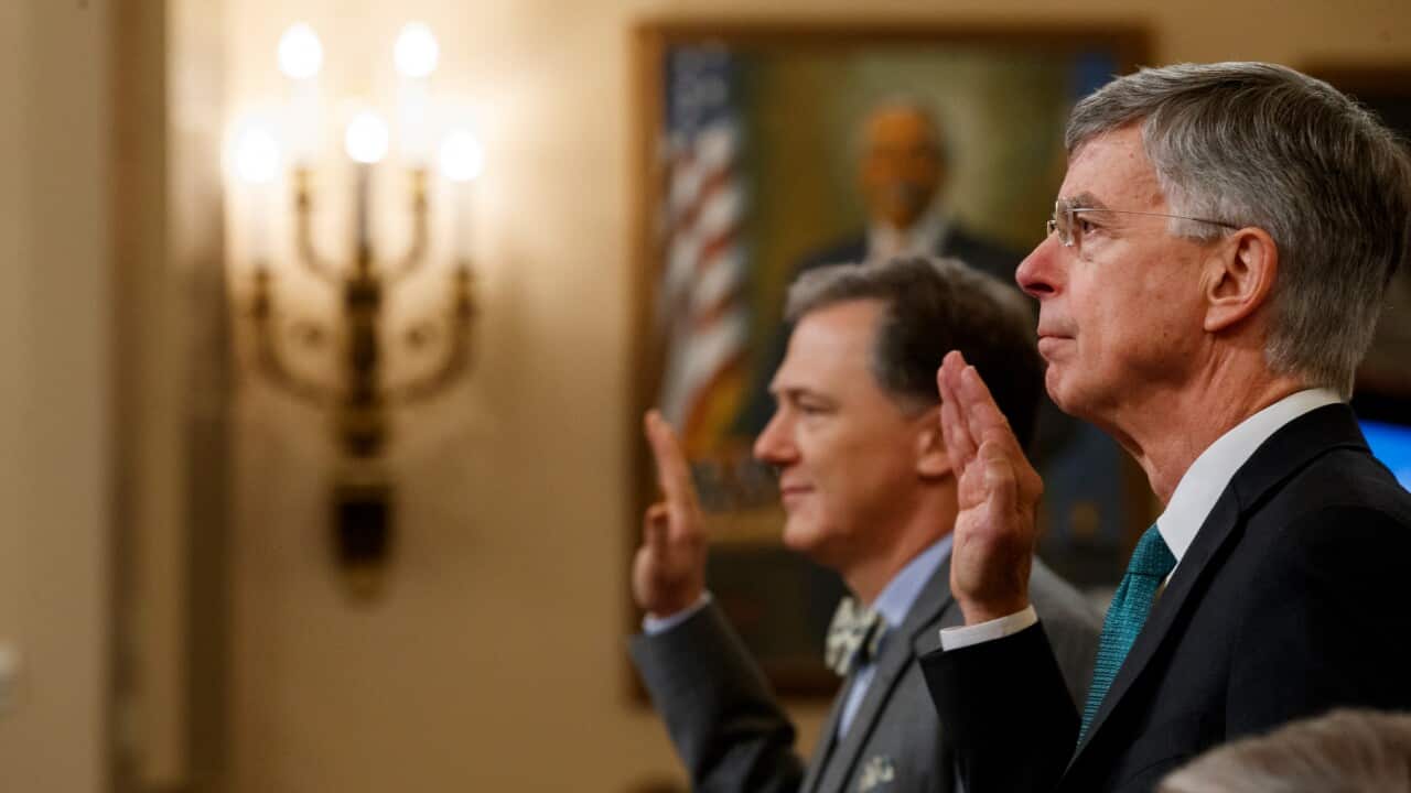 Top US diplomat in Ukraine William Taylor (r) and Foreign Service officer George Kent are sworn in to testify