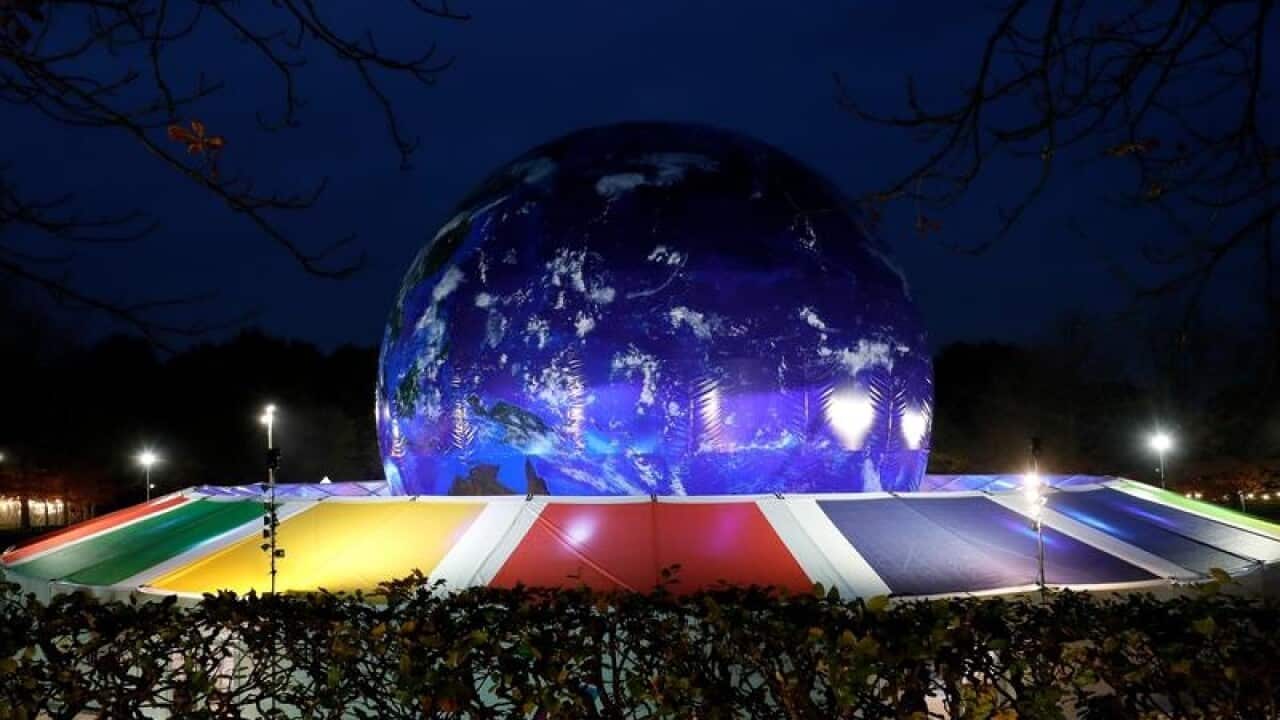 A blue illuminated globe at the site which will host COP23