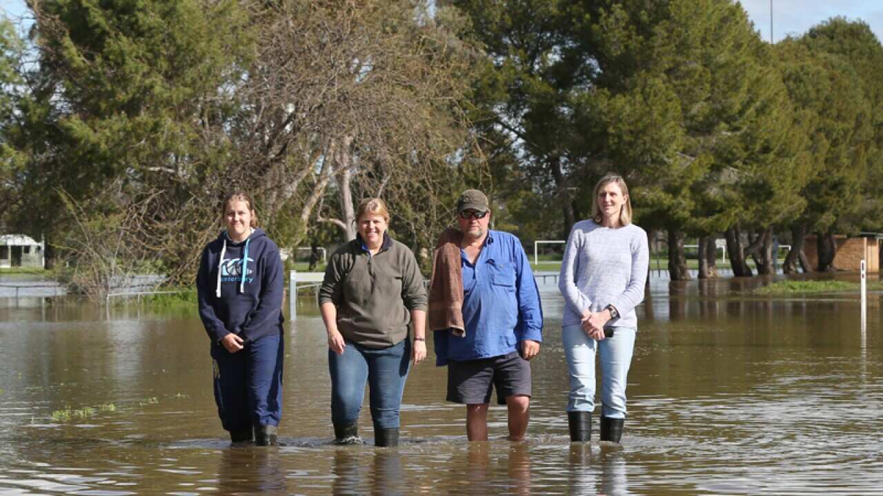 Forbes locals wade in flood waters