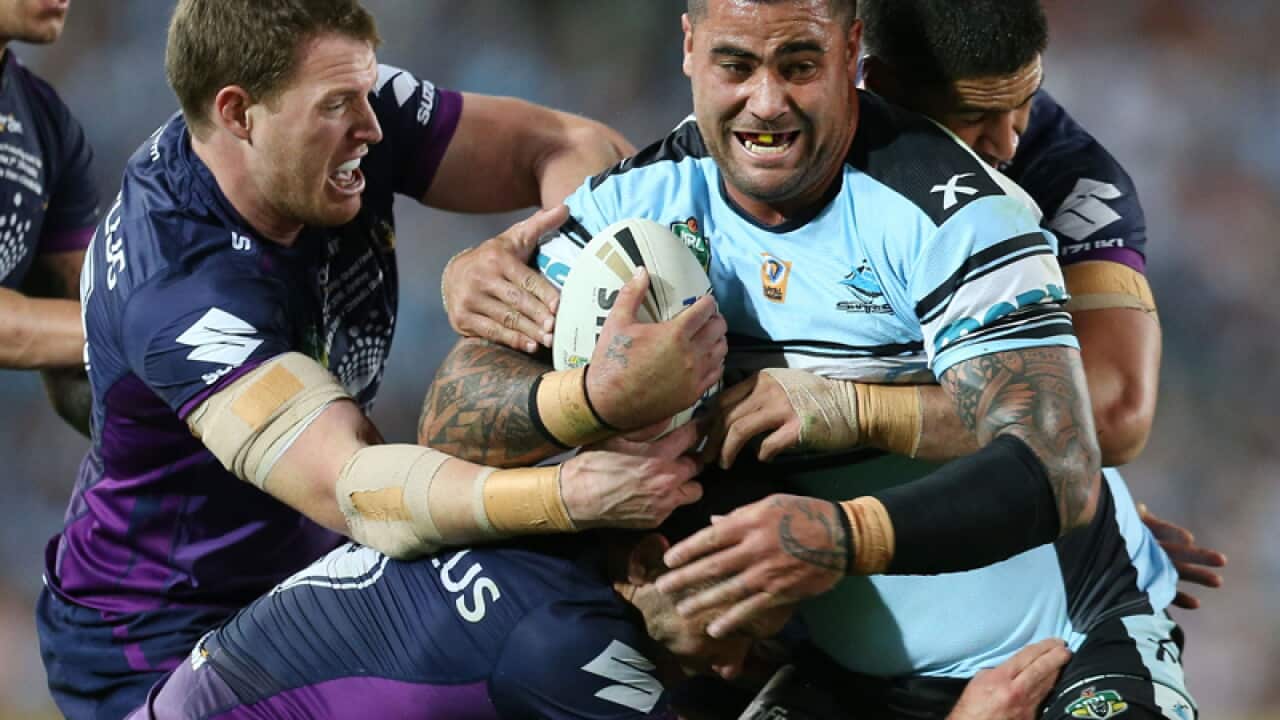 Andrew Fifita of the Sharks is tackled