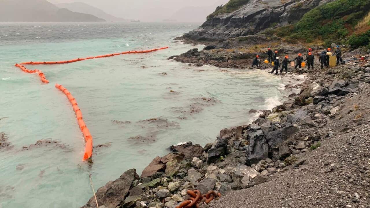 Chile Navy personal working in a control damage from the spill oil at the terminal of Guarello island, Chile.