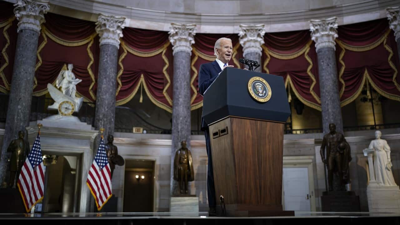 US President Joe Biden delivers remarks on the one year anniversary of the 6 January attack on the Capitol, during a ceremony in Statuary Hall in Washington DC.